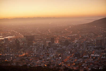 Here comes the sun. Aerial view of a beautiful city at dawn.の写真素材