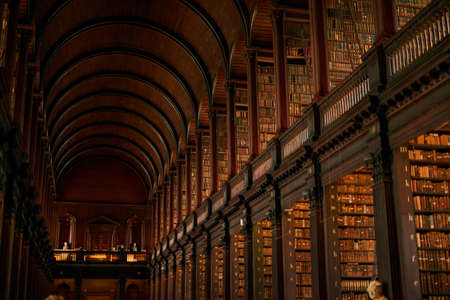 This library is filled to the rafters. Cropped shot of a large, vintage library full of books.の写真素材