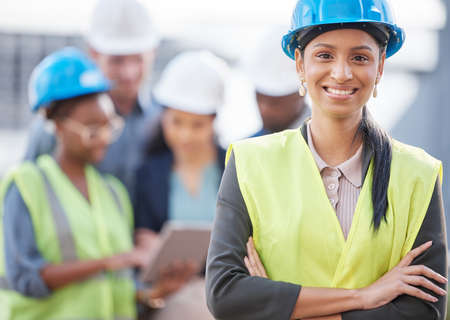 Women owning the construction industry. Shot of a young woman working at a construction site.