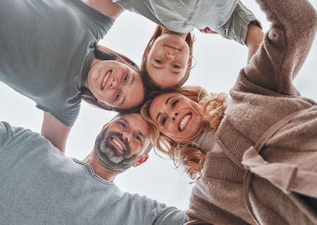 When we have each other, we have everything. Shot of a family of four standing together in a huddle.