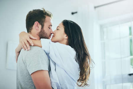 We look forward to spending time together. Shot of a young couple sharing an intimate moment in...
