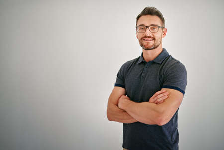 In the prime of my life. Cropped portrait of a mature man standing against a gray background.の写真素材