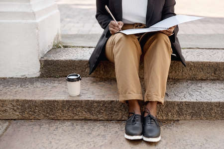 Planning for success, even in her spare moments. Closeup shot of an unrecognisable businesswoman...