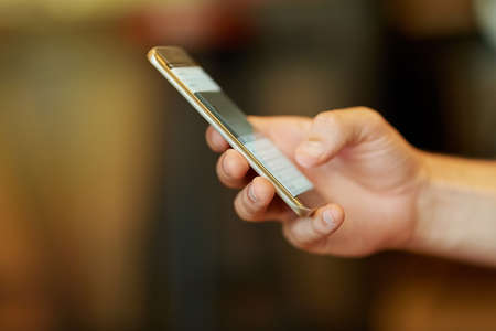 Staying connected 247. Cropped closeup shot of a man using a mobile phone.