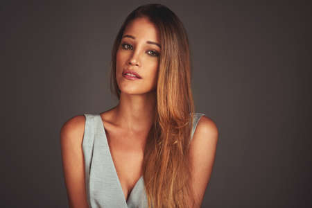 The embodiment of elegance. Studio shot of an attractive and elegant young woman.
