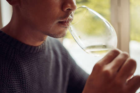 Put your senses to the test. Shot of a young man out wine tasting.