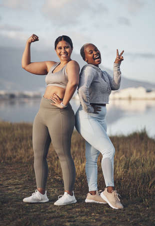 Take your friend along and add some fun to your workout. Shot of two friends out for a workout together.の写真素材