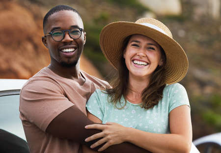 Together is the best place on earth. Portrait of a happy young couple enjoying a romantic road trip.の写真素材