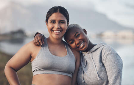 Good friends cheer you on, great friends join you. Shot of two friends out for a workout together.の写真素材