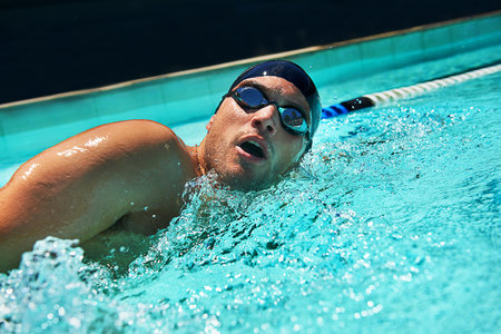 Refreshing exercise. A swimmer in a pool.