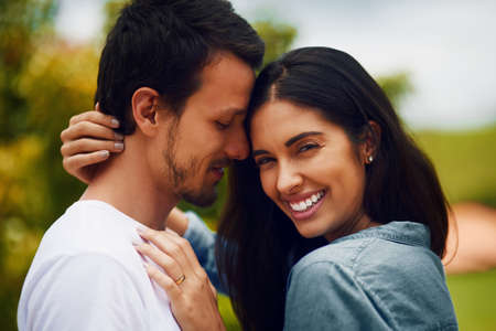 Hes so handsome and hes all mine. Shot of an affectionate young couple spending a romantic day in...