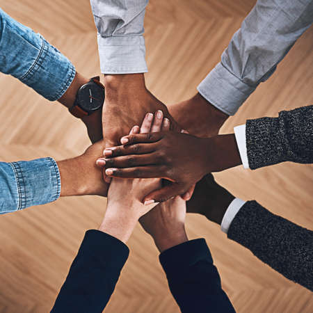 Building a spirit of collaboration and cooperation. High angle shot of a group of unidentifiable...