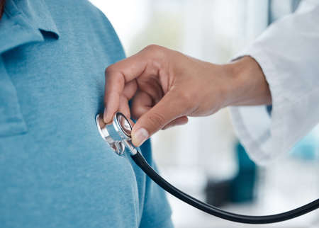 Lets listen to your heartbeat. Shot of an unrecognizable doctor examining a man with a stethoscope...