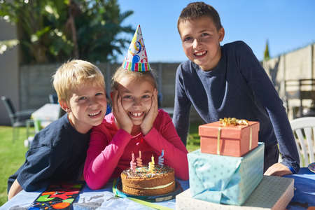 Let the birthday fun and festivities begin. Portrait of a group of young children enjoying an...