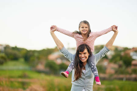 Feeling on top of the world. Portrait of a mother and daughter enjoying some quality time together...