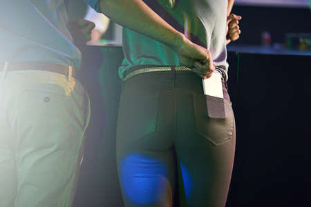 The price to pay for carelessness. Cropped shot of a man stealing a womans phone from her pants...