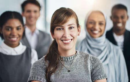 The best team in town. Portrait of confident young business people standing with their arms folded...