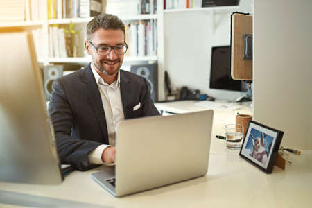 Building his business online. Shot of a businessman working at his computer in an office.