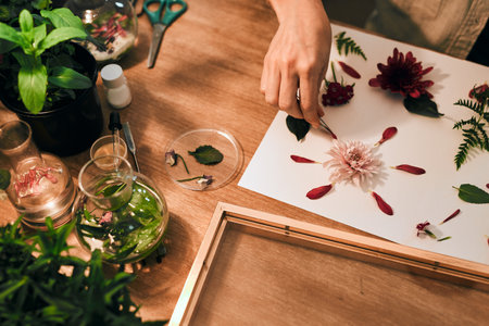 Putting the finally touches on the masterpiece. Cropped shot of an unrecognizable florist decorating...