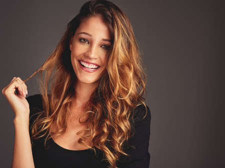 My mood depends on how good my hair looks. Studio shot of a beautiful woman with long locks posing...