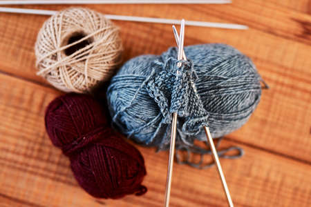 Everyone wants a Christmas sweater this year. Still life shot of multi colored woolen balls and...