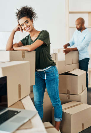 Its a big step, but we couldnt be happier. Portrait of a young couple moving house.