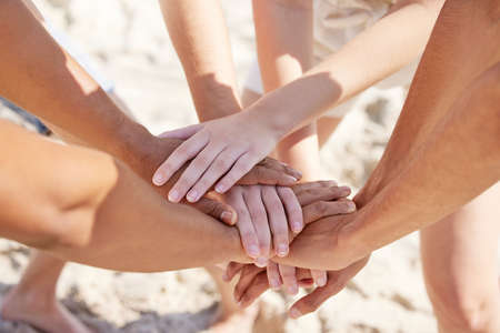 Weve got the team spirit. Shot of a group of unrecognizable people stacking their hands.の写真素材