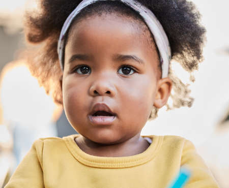 Embrace your younger years. Shot of a little girl playing in a garden.の写真素材