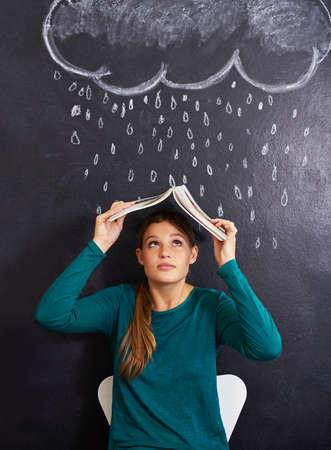 Using illustrations to teach her students. Cropped shot of an attractive young woman standing in...