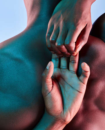 The first and greatest victory is to conquer self. Shot of a muscular man posing against a studio background.の写真素材