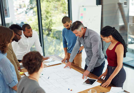 Design is creativity with strategy. Cropped shot of a group of architects in the boardroom.