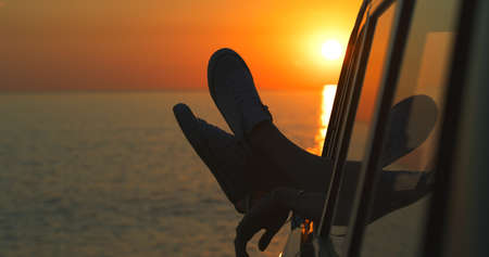 Hang your legs and just chill. Cropped shot of an unrecognizable womans legs dangling out the window...