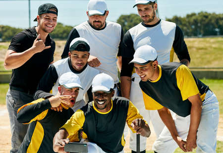 Selfie time with the winners. Cropped shot of a team of young baseball players staking a selfie...