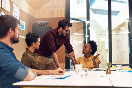 Taking steps to ensure success together. Shot of a diverse group of businesspeople having a meeting...