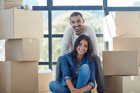Weve got a lot of unpacking to do. Portrait of a happy young couple moving into their new home...