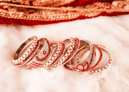 Glam up your look with these. Shot of beautiful bangles for a bride to wear at a traditional wedding.の写真素材