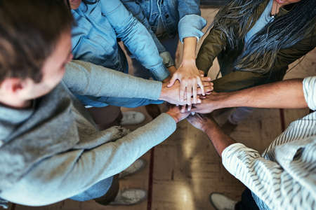 Theyre in it together. High angle shot of a group of unrecognizable university students standing...