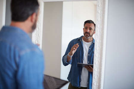 Okay you gotta do better than this. Cropped shot of an attractive mature man having a rehearsal in...