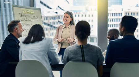 Good morning everyone I hope youre well. Shot of a mature businesswoman giving a training...