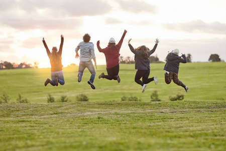 The fun never stops when were together. Rearview shot of a group of friends admiring the view...