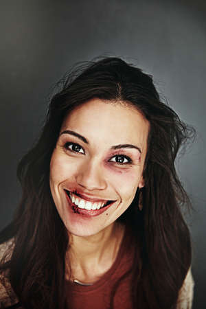 I refuse to be a victim any longer. Cropped portrait of a beaten and bruised young woman.