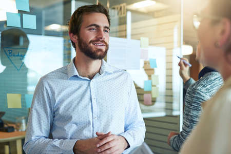 Id be interested to hear your ideas in depth. Shot of businesspeople brainstorming in an office.