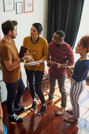 Try to put yourself in the potential clients shoes. Shot of a group of creative workers having a...