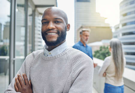 I havent gotten this far on my own. Cropped portrait of a handsome young businessman standing with...