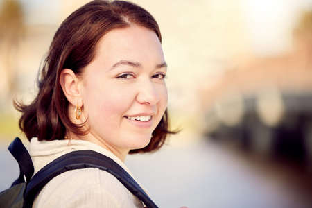 Come with me on this trip. Shot of a beautiful young woman out in the city.