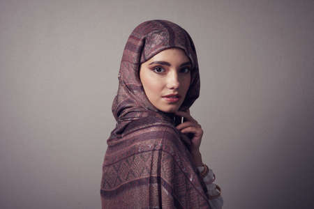 Her beauty will capture your heart. Studio portrait of a cheerful young woman wearing a colorful...
