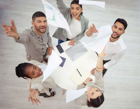 The value of achievement lies in the achieving. Aerial shot of a diverse group of businesspeople...