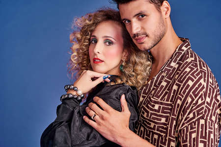 Everyone loves a good love story. Studio shot of a young couple styled in 80s clothing.