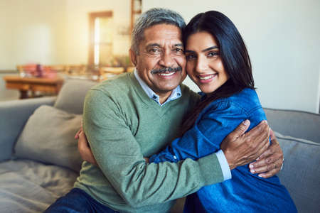 Shell always be my little girl. Portrait of a cheerful senior man posing with his daughter while...