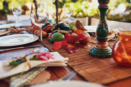 Santa isnt the only guest you have to impress. Cropped shot of a the layout of a Thanksgiving dining table.の写真素材